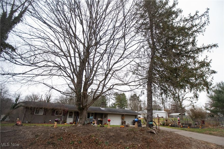 Charming 3-bedroom, 1,499 sq. ft. home with two living areas and a cozy gas fireplace. Features a large primary bedroom, newly updated bathroom, and a two-car attached garage. Enjoy the backyard patio with an outdoor fireplace, surrounded by large trees. Convenient location with easy access to Marietta!