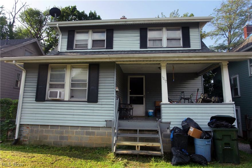 Currently an income producing single family rental property this home has large rooms, fenced yard, and a large garage with alley access. Large rooms. Basement has laundry hook up, newer hot water tank, unique tile floors, loads of storage and an additional toilet. Current monthly income is $700/month, tenants pay all utilities. All appliances to remain. Call for even more financial details or to schedule a showing!