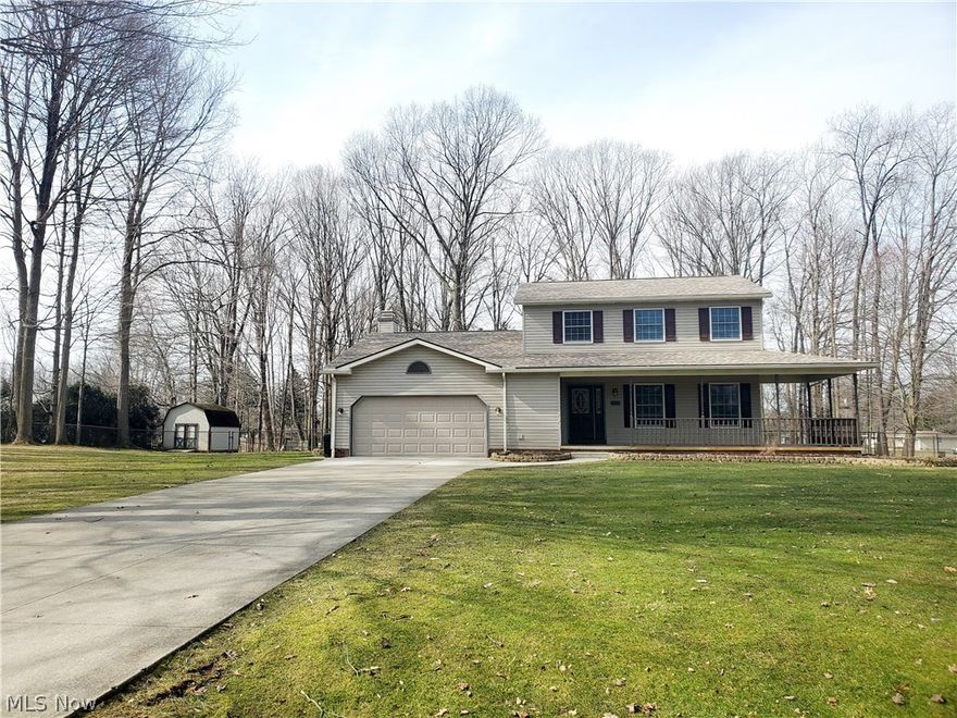 This home is BEYOND spectacular! Beautiful two story colonial on almost one acre of land! Quality throughout! Open and inviting floor plan is ideal for anyone who loves to entertain! HUGE family rm with newer laminate floors and a cozy, corner fireplace with gas logs! The kitchen has newer countertops and never ending cabinet space!  Very cool doggy door in the living rm is one of a kind! It has a sliding door that is triggered by a sensor attached to your pets collar! It will automatically open, close and lock by itself!  It leads from the living room to the completely fenced in rear yard! Newer hot water heater and roof in 2014, gutters w/ leaf guard in 2018, furnace and central air unit in 2019, all 3 bathrooms have newer countertops, interior paint throughout along with newer laminate flooring! Large shed and fire pit in the rear yard! Oversized attached garage is HEATED and has water hookup and a ceiling fan! Full basement is enormous! So many things you can do downstairs! There's