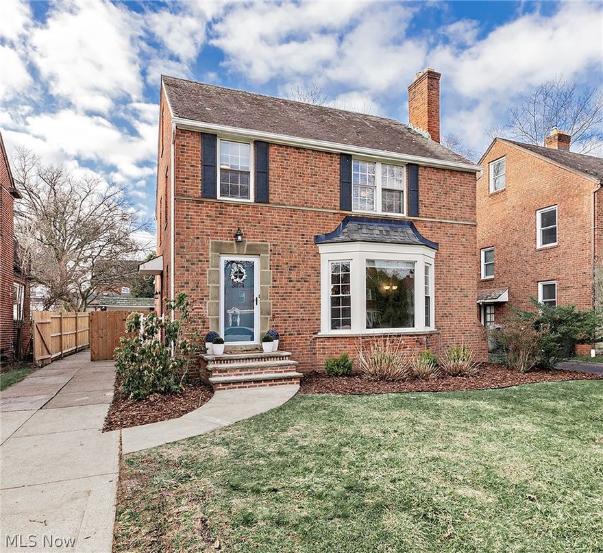 Beautifully updated and meticulously maintained, this classic brick Colonial in sought-after University Heights offers timeless charm paired with modern comfort. Step inside to discover inviting, multi-level living spaces designed for both everyday living and effortless entertaining. The main level features a spacious living room, formal dining room, a newly carpeted family room, half bath along with an eat-in kitchen perfect for casual meals and gatherings.  The elevated kitchen features abundant Kraftmaid cabinetry, quartz countertops, gas range and stainless steel appliances.  Rich hardwood flooring flows throughout much of the home, complementing the thoughtfully updated bathrooms and overall fresh, move-in-ready feel. Upstairs, you’ll find three well-appointed bedrooms on the 2nd level and updated full bath with a separate shower and bathtub.  The finished third floor provides a cozy guest or teen suite which has been freshly painted + new carpet and a convenient half bath—ideal for added privacy and flexibility.  Enjoy the lower level recreation room with new flooring, paint and serve drinks and snacks from the wet bar.  There is new drylock flooring in the utility and laundry area as well.  Enjoy outdoor living on the freshly painted deck, newer wood privacy fence, creating a serene backyard retreat. A detached two-car garage and abundant storage throughout add to the home’s functionality. Ideally located within walking distance to Walter Stinson Park and close to shopping, dining and a short ride to Cleveland's world class hospitals and cultural hub of University Circle.   This home truly offers the best of comfort, convenience and classic architecture in a tree-lined neighborhood of University Heights.  Please refer to the Seller Improvements and Key Features list in MLS Supplements.  A brick beauty not to be missed!