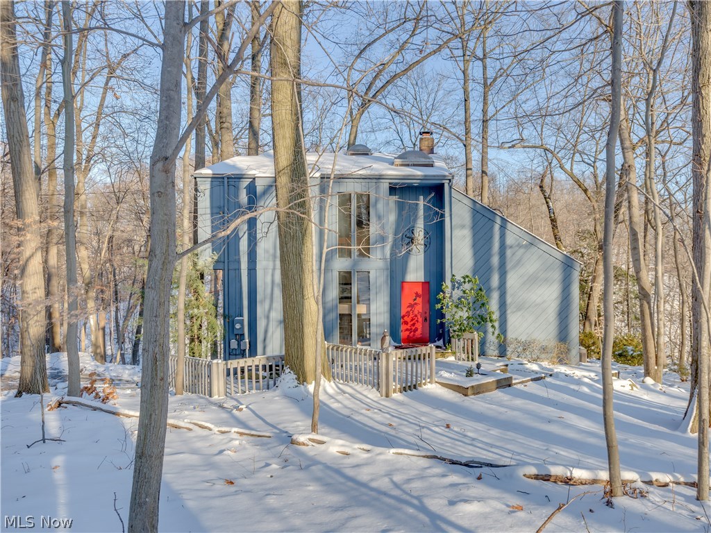 One of a kind, rustic and contemporary cottage on 1.6 acres set in Cuyahoga Valleys Gorge area. 360 degrees of absolute gorgeous park views - THIS is your cottage retreat. Beautiful updated chefs kitchen and master bath. First floor is all redone with open fireplace and amazing vaulted wood ceilings.