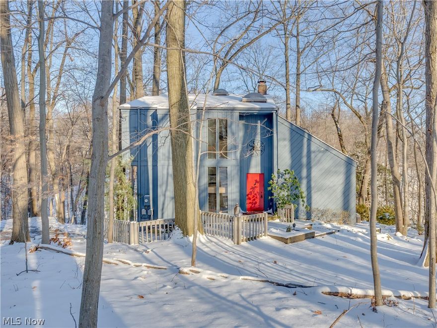 One of a kind, rustic and contemporary cottage on 1.6 acres set in Cuyahoga Valleys Gorge area. 360 degrees of absolute gorgeous park views - THIS is your cottage retreat. Beautiful updated chefs kitchen and master bath. First floor is all redone with open fireplace and amazing vaulted wood ceilings.