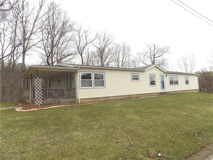 Exceptionally well maintained, one owner manufactured home on 7+ acres. This 2052 square foot main level offers open concept dining area, family room and large kitchen with center island and plenty of cabinet space. The heart of the home offer a formal living area, 2 guest bedrooms, full bath and spacious master bedroom with walk in closet and private full bathroom. The lower level is totally finished and offers an additional 819 square feet with kitchen area, additional family room with gas fireplace, utility area and access to the 2 car garage. The 7+ acres is primarily wooded. Updates include roof and windows in 2002, flooring and kitchen cabinets. The lower level family room offers propane fireplace.