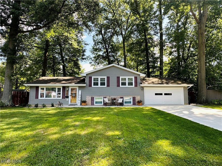 Welcome to your dream home! This beautifully updated split-level residence boasts an inviting open floor plan that seamlessly connects the living room, dining area and kitchen on the main level. The spacious living room is perfect for entertaining guests or enjoying cozy nights, while the dining area provides an ideal setting for memorable meals. The modern kitchen features updated appliances, ample cupboard space and counter seating, making it a joy to cook and gather with loved ones. Ascend to the upper level, where you will find three nice-sized bedrooms, each designed to offer comfort and tranquility. The remodeled bath on this floor showcases contemporary fixtures and finishes, providing a spa-like experience for your daily routines. Whether you need a peaceful retreat, space to work or room for family members, this level ensures everyone has their own personal haven. Venture down to the lower level where a spacious family room awaits, perfect for watching the big game or hosting movie night. This level also includes a convenient half-bath and a laundry room, making chores a breeze. Step outside to discover a huge backyard that is a true outdoor oasis, complete with new privacy fencing, a deck for summer barbecues, a charming gazebo and a storage shed for all your gardening tools. With a new concrete driveway, a newer roof and an updated HVAC system, this home is not only beautiful, it's practical, too. Start packing...this is the house you've been waiting for!