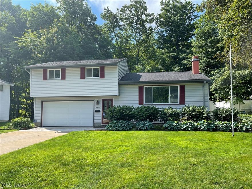 Clean & Classic Home on a double lot!! Imagine yourself in this 5 Bedroom set in Nature with a deck overlooking the Wooded Ravine, there is even a Treehouse at the bottom. No neighbors behind you because you own the wooded lot behind your new home. Move in ready condition with new flooring in the kitchen and both upstairs bathrooms. Enjoy the Biking and Hiking trails as well as the Parks and recreation Twinsburg has to offer. Close to shopping/dining & all major freeways. New electric service line installed, concrete driveway (with drain) and sidewalk repaired 2021. Fresh paint inside, Leaf gutter guards installed, newer garage door and opener.  New hot water tank in 2019. Carpets just professionally steam cleaned. Comes with a One year Home Warranty!!