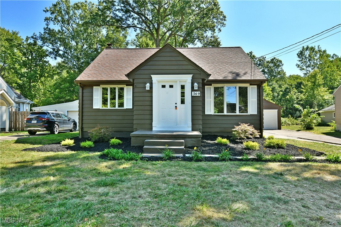 Welcome to your NEW home where cottage feel meets modern updates! This move-in-ready Hubbard home should be at the top of your list with its great looks inside and out plus an impressive 3 levels spanning over 1900 sq ft of finished space layout. The prime location puts you within a highly desirable neighborhood on a quiet private street with wooded backdrop. The terrific residence peers out from beneath the trees as you quickly note the warm brown and black accents that give it a cottage feel. Beautifully manicured landscaping follows multiple mulch beds that lead around to find the must-see covered rear patio, ready to entertain in shady, natural privacy. Inside, a spacious living room sets the tone as neutral vinyl plank flooring runs through the kitchen. Sunshine filters through the tall windows for plenty of natural light. Around the corner, the combined kitchen and eat-in dining space offers casual backyard views and custom made cabinets and huge storage pantry. New stainless appliances pair with the granite countertops and rustic stone backsplash, adding to the appeal. Down a short hall, a custom tiled full bath accompanies a pair of carpeted bedrooms to complete the floor.
Upstairs, a loft room with storage galore and walk-in closet. Down below, a full finished basement offers laundry service, a second full bathroom recently added with custom stone shower and vanity. The fully furnished rec room offers expansive built ins and a cozy fireplace to complete the cottage feel.
This home offers a new HVAC system, electrical panel and glass black windows. Completely renovated top to bottom, inside and out and ready for your enjoyment. It won't last, call for your private showing.
