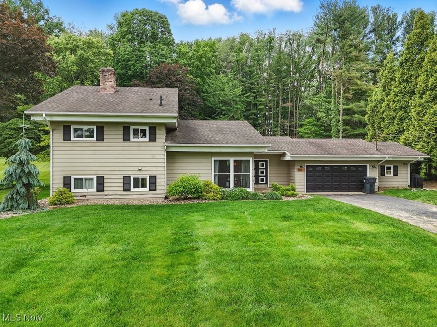 Welcome 5661 Caranor Road—a charming multi-level home situated on a quiet residential street in the heart of Kent. This 4 bedroom, 2 bath property offers a rare combination of modern updates, functional design, and a private, park-like setting just minutes from Kent State University, Dix Stadium, and the Portage Hike & Bike Trail.
Inside, the home features a bright and spacious main living area with exposed wood ceiling beams and abundant natural light. The kitchen has been updated to include warm butcher-block countertops, a custom lazy susan, and stainless steel appliances including a new stove (2022) and refrigerator (2019).
The lower-level family room provides a flexible secondary living space with brand-new carpet installed in 2025, and a wood-burning fireplace highlighted by a custom live-edge mantel (2023). Two full bathrooms—one on the upper level and one on the lower—have been enhanced with quality finishes and provide convenience for guests and growing households.
Step outside to enjoy a covered back patio, ideal for entertaining or quiet relaxation, surrounded by mature trees and a fully fenced backyard with a split-rail system and dual access gates (installed 2021). Additional outdoor features include a detached storage shed and professionally landscaped front yard (2022).
The home is equipped with a high-efficiency Trane HVAC system (2019, serviced annually), updated gutter drainage (2023), and a reinforced attic (2019) for added storage. Additional storage options include dedicated areas in the garage and lower level.
Located in a welcoming, multi-generational neighborhood with nearby community amenities, this home offers both immediate livability and long-term value. Schedule your private showing today to experience all that 5661 Caranor Road has to offer.