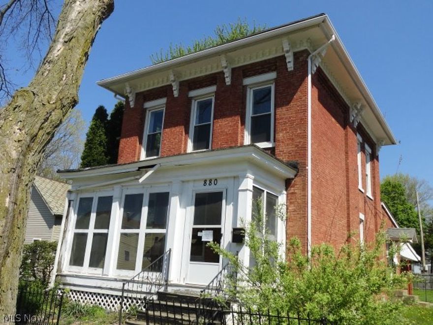 Unique 2 bedroom, brick, colonial, walk up attic, spacious living room and dining area, attached 2 car garage, basement, enclosed front porch and more