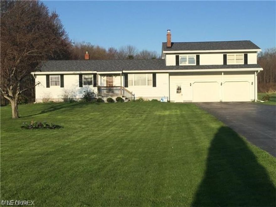 5 bedroom 2 bath home with big kitchen and living room and extra living space in the basement and great yard with pond.