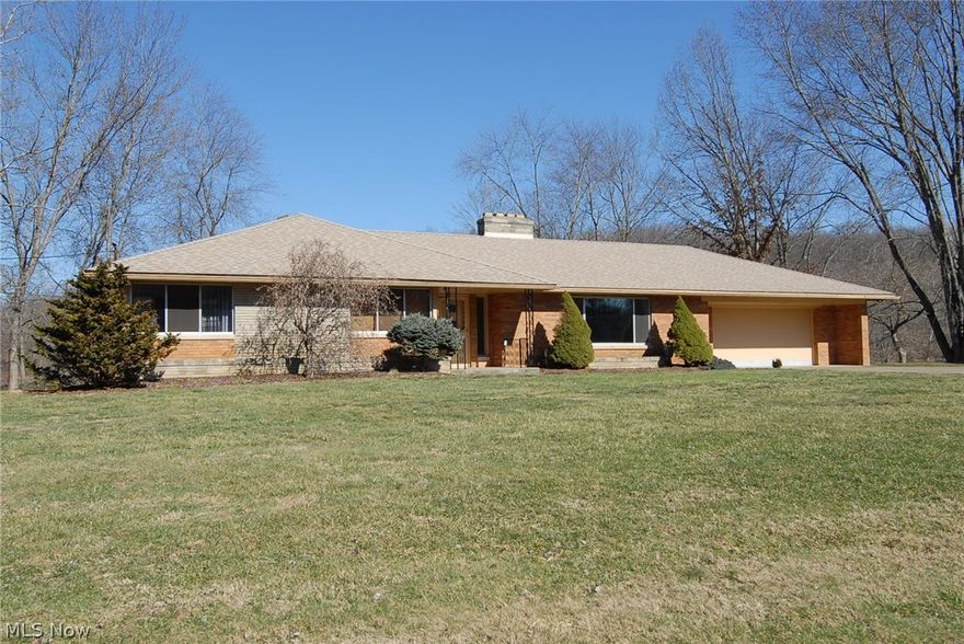 River Front Property with over 200 foot river frontage (includes dock)  Updated Brick ranch overlooking the Muskingum River Newer roof, furnace, air, Beautiful custom kitchen with Russian granite countertops, custom cherry cabinets, beautiful lyptus hardwood floors, stainless steel appliances.  Gorgeous stone fireplaces on both levels.  Lower level features Spanish ceramic tile floor, and marble stone woodburning fireplace and bar in family room, two bedroooms, gorgeous updated tiled full bath, laundry room