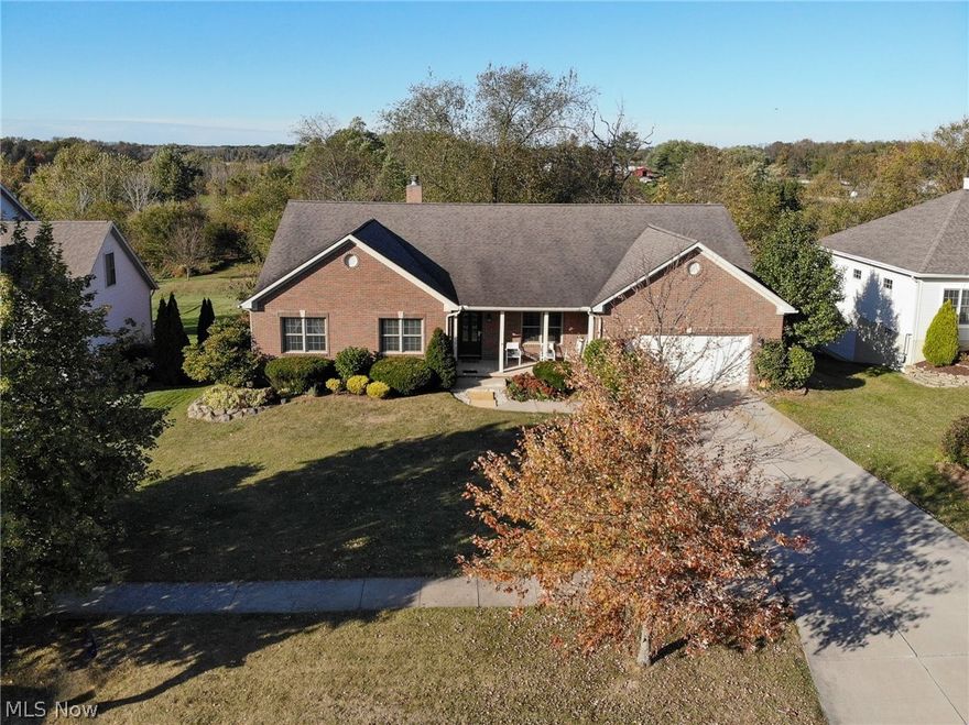 1181 Windward Ln, Kent, OH 44240 is a GORGEOUS 4 Bedroom & 3 Full bathroom, over sized 2 car garage with pull down stairs for storage, all Brick exterior RANCH home with a full walkout lower level! Home includes a large rear deck for the 1st floor level and large rear patio from the walkout basement level! The view is private and AWESOME overlooking undeveloped private land with a pond as well as a tiered professionally landscaped yard! Don't miss this opportunity for one level living at its finest in the highly sought Forest Lakes Development on the Kent Stow border! There is an office room in the back hall near the garage entry & laundry room that is PERFECT for a home based office or could use as an additional 1st floor bedroom or huge mudroom! Hardwood floors abound throughout the Foyer Entry, Formal Dining Room, Hallway, Living Room & Rear Family Dining Area! New plush carpeting in the Bedrooms & Office Room with newer ceramic tile throughout the 2 full main level bathrooms as wel