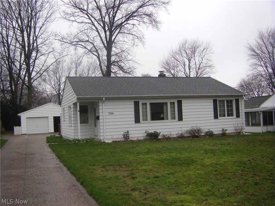 Very neat and tastefully decorated with neutral colors, replacement windows, and a hall featuring built-in bookcases. Deck in rear of home.  The roof is approximately 2.5 years old (tear-off), the heat pump with electric furnace back-up is approximately 2 years old, and the breaker panel has been updated. Gas water heater.  An oversized 2 car garage and cement drive.