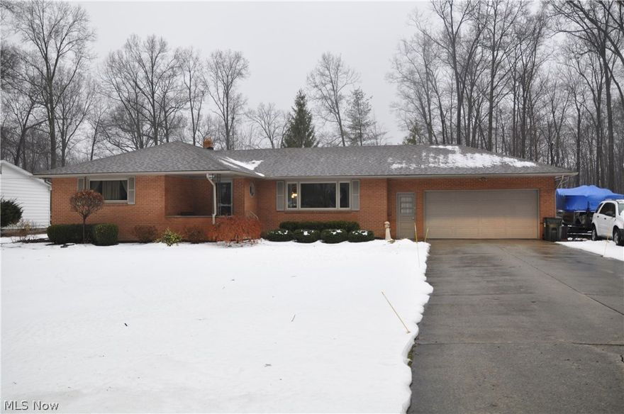 Beautifully updated 3 bedroom brick ranch w/new roof, windows, water heater, remodeled kitchen w/granite counters & ceramic tile, living room w/crown molding & gas fireplace, hardwood floors under all carpets, newer furnace, AC & electric service, tiered decking & 2 sheds. Beautiful lot in prime Howland neighborhood!