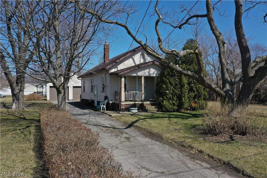 Great investment opportunity.  Two bedroom (tandem) bungalow with newer vinyl siding and furnace, just a little love inside to bring this home back to life.  Great two car garage, second lot zoned commercial included in list price parcel ID 02-01-003-110-003.