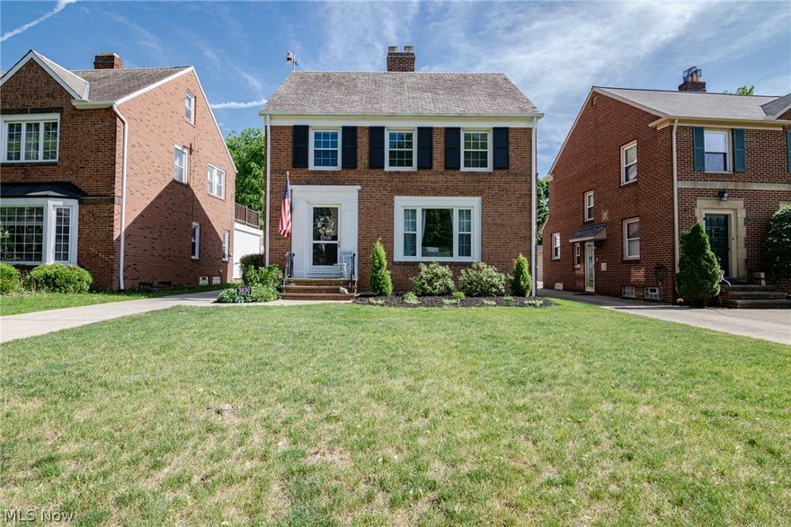Move right into this charming and beautifully maintained brick colonial in University Heights! This lovely home features hardwood floors, an updated eat-in kitchen, recently renovated bathrooms, a slate roof and more! The front door opens into the sunny and welcoming living room where you will find a gas fireplace and refinished hardwood floors. The attractive dining room has a nice built-in corner cabinet as well as hardwood floors. In the kitchen you will find a full complement of appliances, newer maple cabinetry, and a lovely eat-in area. There is a 3-season room at the back of the house that has newer windows and carpet. A convenient half bath completes the first floor. Upstairs are three bedrooms, all with hardwood floors and plenty of sunlight! The very spacious master bedroom has two closets and a newer ceiling fan. The full bathroom was completely redone less than 2 years ago and includes a subway tile shower, ceramic tile flooring, and a lovely vanity with a quartz top. There
