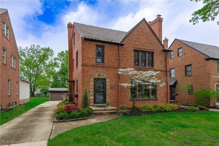 Pretty as a picture! Classic charm in this beautifully maintained 1940's brick Colonial, ideally located on one of the area’s most sought-after streets.