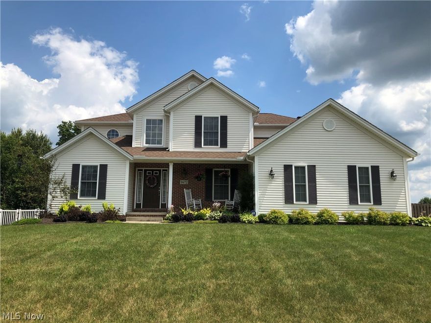 This gorgeous well maintained home boasts high ceilings, neutral colors and tons of light.  You'll be welcomed in by the beautiful new engineered hardwood floors leading past the large office and adjacent dining room to the open great room with stone fire place and spacious kitchen.  The first floor master has great space and character as does the attached newly renovated master bath with walk in closet.  Enjoy all new carpet upstairs in all 3 bedrooms and cozy loft, as well as the full finished basement or take in the nature outside on the grand deck in your peaceful fenced in back yard.  This is a must see!