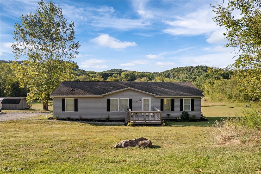 Welcome to 7002 Wardell Hollow Rd SE! This beautiful home sits on over 6 acres of FLAT land on a dead-end street. This home offers 3 bedrooms, 2 bathrooms, and a bonus room. Remodeled in 2021, this home features a lot of NEW! Newer siding, roof, gutters, flooring, fixtures, and updated windows. Nothing left to do except move in! A freshwater spring is located near the back of the property. New hot water heater and Culligan Smart HE water softener system, along with a storage/garage shelter will stay. Call today to schedule your private showing!