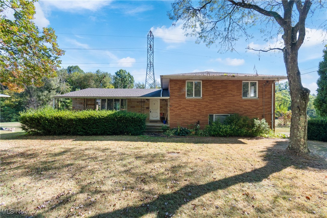 Welcome home to 2395 Hull Dr in Copley. This spacious split level has much to offer. The home boasts four bedrooms, 2.5 baths and roughly 2300 square feet. The property is private offering a wooded back-yard, with oversized shed and brick pizza oven. The first tier has an open floor with a large living room and huge front windows, formal dining and remodeled kitchen. Kitchen includes butcher block counters, island, newer white cabinets and newer appliances. Lower tier includes the family room with full wall sandstone/woodburning fireplace along with a half bath, this connects to the patio and backyard. Lower level includes large basement with tons of storage. Top tier features master suite with full bath, additional three bedrooms are generous in size and share second full bath. Updates include newer metal roof on shed, basement has been waterproofed, hot water tank (2016), furnace (2016) and , roof (2021),electrical panel is 100amp. Home does need a touch of TLC but we are leaving that up the new owner. Call/text for your private showing today!