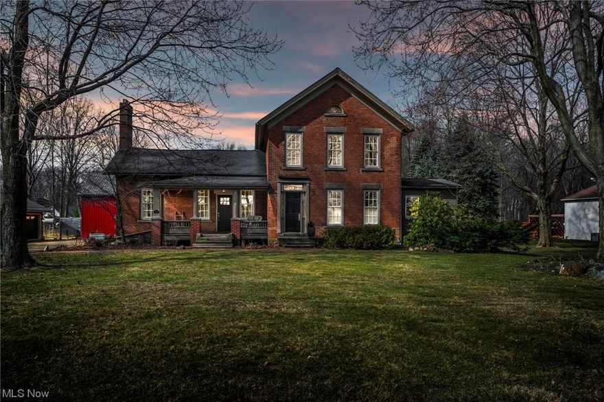 Updated Historical Estate built in 1866! This beautiful 4 bedroom, 4 bath and 4 car garage sits on approximately 3.23 acres. Great Room features custom stone wall, enormous fireplace and beamed ceiling.  All Baths have been updated and features tiled showers.   This home is full of character like you have never seen before. Exposed beams, brick walls, secret spaces are just some of the many features you will find in this timeless beauty. Enjoy views of nature through the screened in porch or stamped patio. Entertaining is easy with a fully finished Timber Framed Barn and Wood Fire Oven is perfect for those homemade pizzas!  You won't find another property like this located in the heart of Avon!