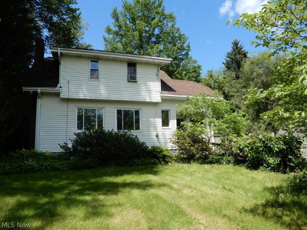 Great opportunity to own this home as an investment or owner occupant! Hard to find floor plan features first floor bedroom, full bath, and laundry, while upstairs has 2 bedrooms and another full bath. Galley kitchen, formal dining room, mud room, and living room w/hardwood flooring. Large newer paved driveway leads to a huge attached (via walkway) 2 car garage. Appears to have a newer roof with architectural shingles, newer furnace and air, most windows are vinyl replacement. Basement has been waterproofed. Low-maintenance yard, two storage sheds, don't wait on this one!