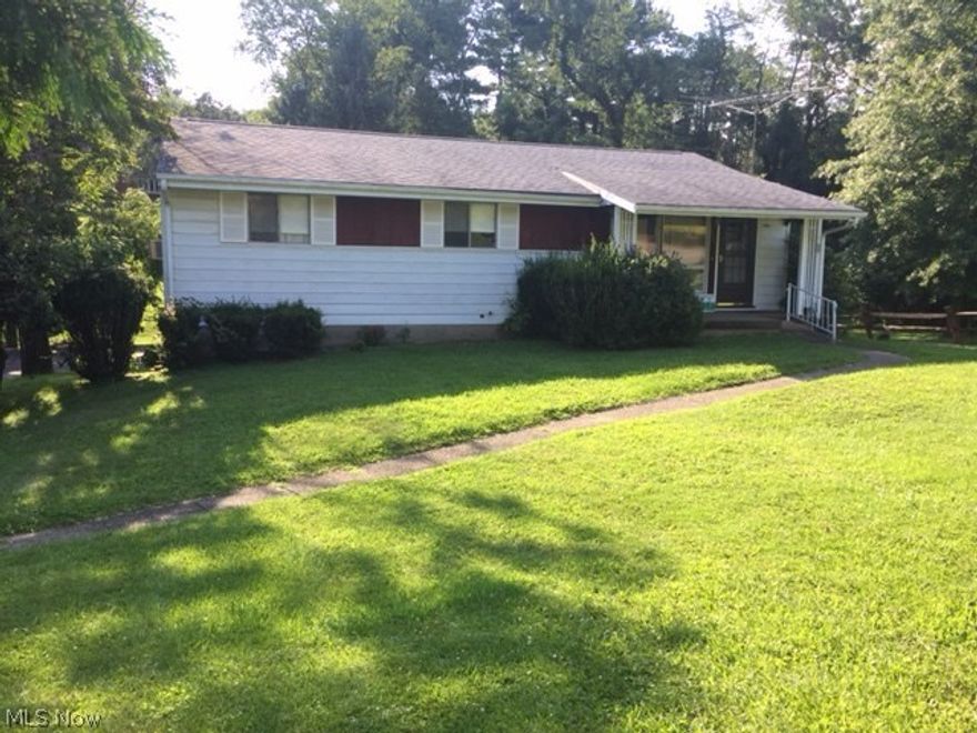 Motivated Seller! This solid 3 bdrm, 3 bath ranch sits on 3 lots, just under one acre!  There is a spacious eat in kitchen.  The master bedroom includes a 1/2 bath.  The walk out lower level offers a family room with a  wood burning fireplace and sliding glass door that leads out to the huge yard.  There is also a 1/2 bath on the lower level.  On the property is a mini barn/storage shed.  Any mineral rights seller would own passes to the buyer. Seller is offering a 1 yr. America's preferred home warranty.