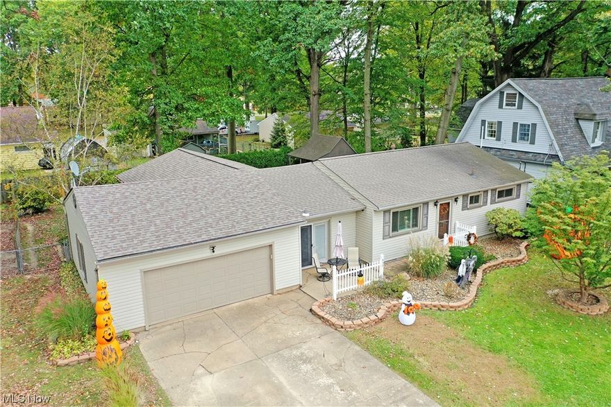 With its great looks inside and out, paired with its scenic tree-lined backdrop, this gorgeous Niles residence will put the ‘fall’ into falling in love! Take in the best part of the season with the expansive, covered rear patio making a perfect place to entertain or relax while a cozy fire pit awaits the storage shed. A second front patio space is found just steps past the family room’s French doors as you make your way inside. The immediate living room welcomes you inside with its warm hardwood flooring. The sizeable picture window helps to illuminate the living space, spilling into the nearby kitchen and dining rooms. Here, tiled flooring pairs with a decorative glass backsplash and deep stained cabinets. Stainless appliances pair with the sink insert for added brightwork. Around the corner, laundry services are located at the patio entrance. The must-see family room branches away, offering lush carpets and a towering brick mantle with fireplace. At the opposite end of the home, a trio of inviting bedrooms join a lavish full bath with its marbled vanity and tile lined shower. 1 yr home warranty provided.