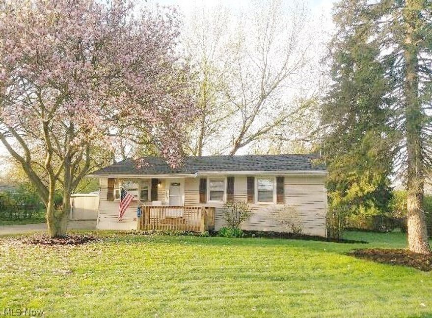 Beautiful 3 bedroom 1 1/2 bath Ranch with 2 car garage plus a carport. Nice front porch and large handicap accessible covered rear deck with canned lighting. Fenced in yard. Extra large finished family room in the lower level has a L shaped bar ready for family gatherings or parties. Stove, Refrigerator, microwave and dishwasher were new in 2016. Refinished hard wood floors. Updates done in the last 10 months include Roof 5/6/18, Humidifier added to furnace, new shower, laundry room added to first floor, (still also has lower level laundry room) added handicap ramp to rear deck. all new paint throughout, Akron foam blew insulation in all of the walls, all new J.C.Penny custom blinds, added carport. Located close to schools, bike & hike trail, bus line, shopping, food and entertainment.