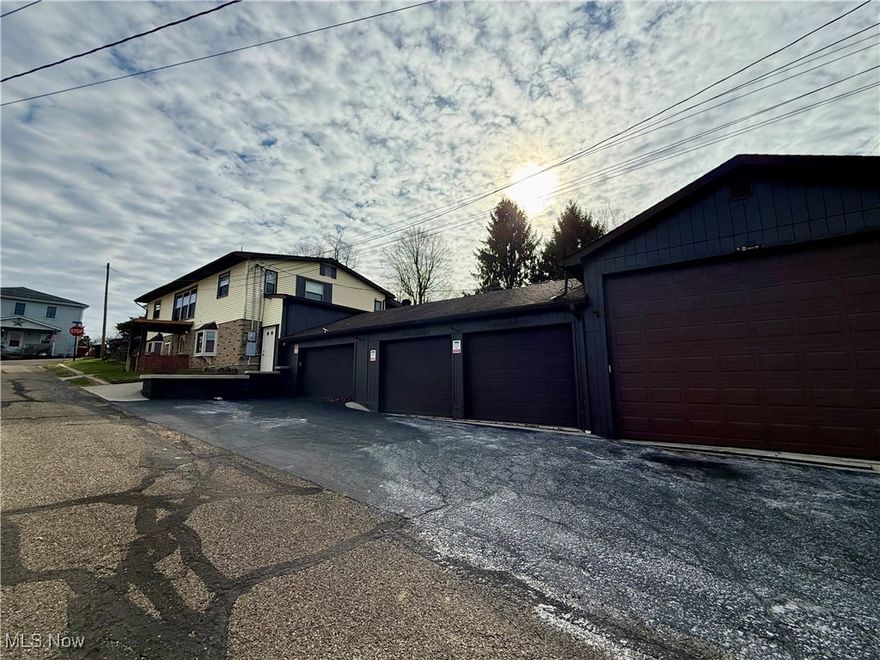 Wonderful, well-maintained ranch home in the heart of Dellroy, offering two completely finished levels and an incredible amount of usable space. The main floor features a spacious open floor plan with a bright living room, dining area, and an eat-in kitchen. Custom handmade built-in cabinetry—crafted by the owner’s father—adds charm and character. You'll also find two comfortable bedrooms, a large updated bathroom with a walk-in shower, and an additional modern half bath perfect for guests. A huge enclosed back porch provides the ideal spot for relaxing and enjoying peaceful views. The lower level has been transformed into a complete second apartment, making this home perfect for multi-generational living, guests, or potential rental income. This fully finished level includes a full kitchen, living and dining area, one oversized bedroom, and a full bath equipped with both a walk-in tub and standing shower. All appliances—two full sets—remain with the home. Quality craftsmanship is evident throughout, with custom blinds, bay windows, real hardwood floors, ceramic tile, and natural stone accents in the porch and breezeway. Major updates include a newer furnace, hot water tank, well pump, and more. Car enthusiasts and hobbyists will love the massive 5-car garage capacity, featuring three single stalls plus a huge RV bay. Part of the garage is equipped with an electric furnace for heating. The fenced-in backyard offers a burn pit, gazebo-style shelter, and a charming he-shed/she-shed, perfect for storage, hobbies, or relaxing retreats. This home truly has too many quality features to list—it’s one you must see in person. Call today to schedule your private tour—this exceptional property will not disappoint!