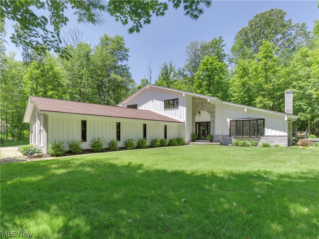 Looking for a spacious & stylish home FILLED with updates in Richfield just minutes from I-77 & 21, turnpike & Furnace Run MetroPark? This awesome contemporary colonial affords large & open living spaces - a light-filled 2-story entry, 2 large living spaces each w a cozy fireplace, updated kitchen, 1st flr laundry rm & finished lower level on 2.76 wooded secluded acres nestled on quiet cul-de-sac! Eat-in kit w soft-close (newly repainted- June) cabs, quartz countertops, brand new s/s appl incl gas range, textured subway tile backsplash, engineered hardwood floors (thruout 1st flr) & huge skylight bringing the outdoors in. Kit open to lrg sunken living rm w woodburning FP, bar w glass-front cabs & sink & slider to covered back patio & deck. Lrg dining rm w slider to backyard. Rounding out 1st flr are formal living rm w skylights, dramatic pitched ceiling & gas FP, laundry/mud rm, brand new full BA w tile shower. Brand new carpet (Jan '19) thruout 2nd floor. Cozy master w totally NEW en