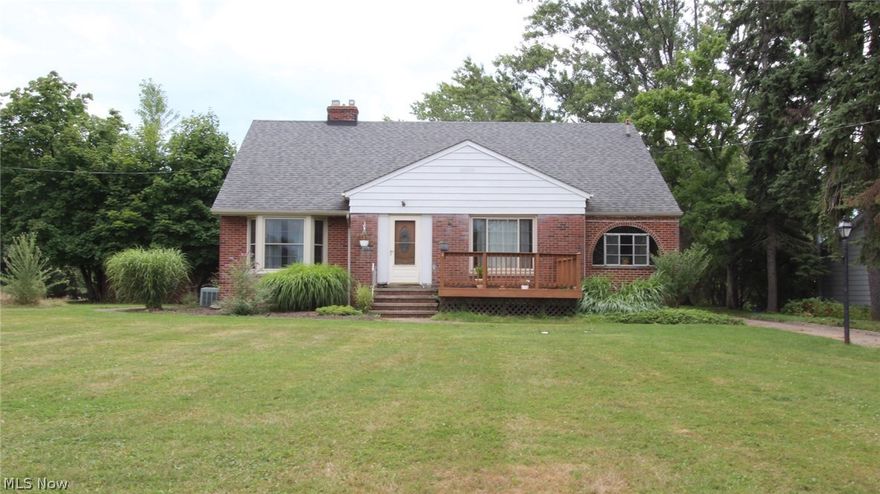 Charming Cape Cod Sitting on 1.5 Acres of land W/ Luscious Fruit Trees! 3 bedroom, 2 bath with additional living space off of the master bedroom. 3 car garage, Full partially finished basement that features a full Wet Bar & Fireplace with an antique functional jukebox. Commercial Central Air Conditioning that quickly cools the house on a hot summer day. Hardwood floors throughout. Home features spacious dining room with cozy gas/log fireplace. The home is nicely landscaped with a freshly re-done front deck, 365 day sun-room with supplemental heating. Kitchen W/ Island Bar, built in cedar cabinets, new furnace 2015, hot water tank 2009, Concrete driveway to the curb 2009, 30 year Roof/ Gutters/ Garage Doors/ Exterior Doors/ Front & Side Windows 2007. Waterproofed front. Home has plenty of storage and additional living space, master bedroom features a dressing room multiple walk in closets. Must see!