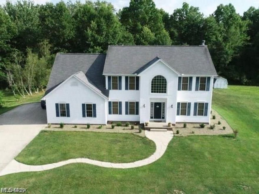 Come take a look at this spacious 4 bedroom colonial sitting on a 2.2 acre wooded lot. This open floor plan home features large foyer entry, huge open kitchen with all stainless appliances and granite counter tops plus large island and planing desk including large pantry. The family room is also large and open to the kitchen with a gas fireplace. Enjoy the morning coffee in the beautiful sun room or walk out to the newly satined deck. The first floor also has an office, formal dining room, 1st floor laundry and 1/2 bath. The second floor has master suite with his and her walk in closets, master bath with soaking tub and ceramic shower plus double bowl sinks. There are 3 additional bedrooms and 1 full bath on the second floor. The full basement is finished with Owen Corning basement walls and all carpeted with drop ceiling. There is a theatre room with platform seating for a fun movie night any night of the week right at home. The basement does have a walkout to the back yard and the ba