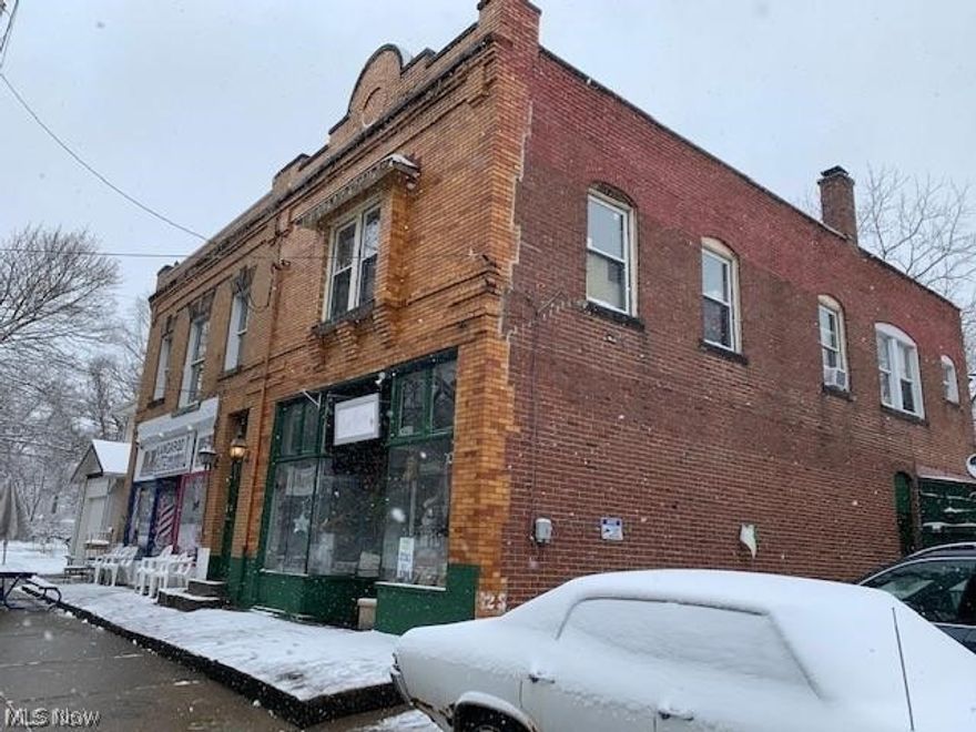 Great investment opportunity! This beautiful brick building includes two commercial suites on the first floor, with large amount of usable space, and the upstairs has two residential units with 2 bedrooms each. There are two additional parcels offering plenty of parking. Close to Highland Square. One block down from the Lebron’s I Promise Schools Village housing! The building has been in the owners' family for over 60 years! Upgrades include vinyl windows, a new roof in 2018 as well as new electric panels, and a new furnace.  Agents please see broker remarks for showing availability.