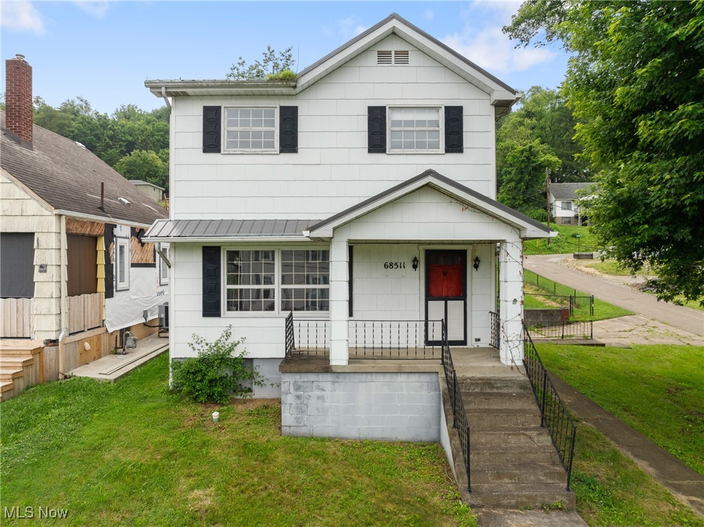 This spacious 3 bedroom, 2 bath home sits on a corner lot and offers nearly 2,000 square feet of living space, including a large family room addition with vaulted ceilings and a beautiful stone fireplace (just awaiting your finishing touch). A great option for first-time buyers or investors looking for solid potential. Features include first-floor laundry, a 2-car garage, generous living space, and a manageable yard. With a little TLC, this home could truly shine!