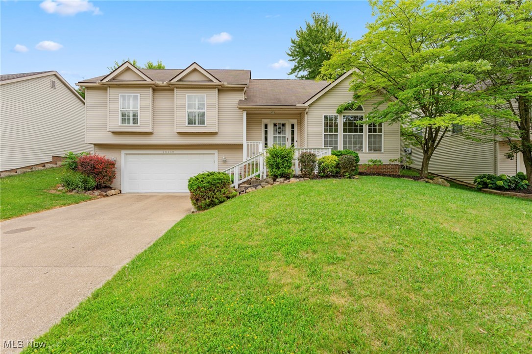Welcome home to 10150 Gloucester Road located in Streetsboro, Ohio! Upon entering this home, you will immediately appreciate the charm this home has to offer! Great room is spacious, offers vaulted ceilings, and a large window - allowing for natural light to carry to the back of the home. A few steps up you will find your updated kitchen with tile backsplash, stainless steel appliances, double sinks, and a built-in desk for paying bills, working from home, or writing down you favorite recipes! Dining room flows nicely into the kitchen for added entertaining space. There is a slider located off the dining room that leads to your deck & spacious back yard! Plenty of room to entertain on this back deck as well as inside! Down the hallway you will find a full bath with granite countertops, 2 bedrooms, and a primary suite. Your primary suite is located at the end of the hallway & features it's own full bath with granite countertops and a walk-in closet. Downstairs in the lower level you will find a spacious family room with built-in shelves for books, games, crafts, toys, etc. Your laundry room is located next to the family room and features a sink, washer & dryer hookups (electric), and a door that leads to your storage room. Storage room features shelves, houses the mechanicals of the home, and has crawl space access for added storage! New furnace & carpet throughout! Don't miss out on this one - call for your private showing before this gem is SOLD!