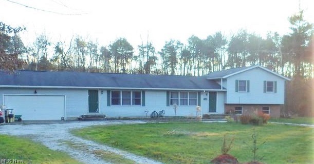 This home located on a cul-de-sac offers plenty of privacy. Nestled back on over 5 acres with a beautiful back yard view of wooded lot. Split level plan plan offers two living spaces with shared finished lower level. Four bedrooms, four bathrooms, two kitchens, two livingrooms. additional family room. Master suite with private bath and balcony overlooking back yard. Finished lower level with bar, two sets of French doors and shared recreation rooms great for entertainment! Sauna with changing area. Large laundry room. Two car garage.