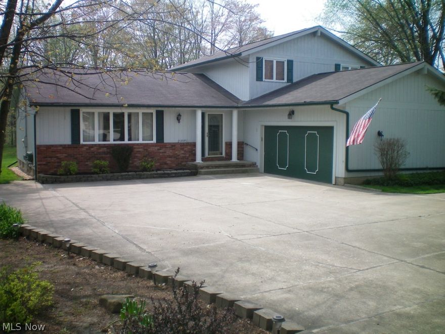 Spacious, 4 Bedroom, 2 1/2 Bath, Split-Level with Basement and oversized 2 Car Garage. Beautiful 1 Acre wooded lot with 19 x 11 Storage Shed that has electricity. The Eat-In Kitchen opens to a Family Room with Woodburning Fireplace, that has a huge 25 x 16 Deck off of it. There is an oversized concrete drive with a turn around that will accomodate many vehicles. The home comes with a One Year warranty !