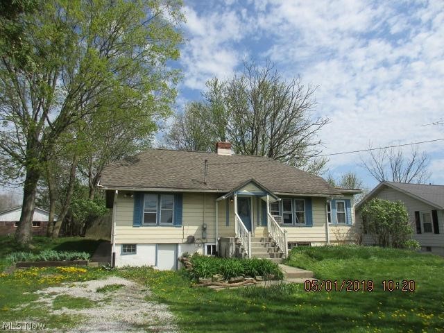 Cozy 2 bedroom ranch on a large lot features partially finished basement, fenced yard, sunroom & fireplace.