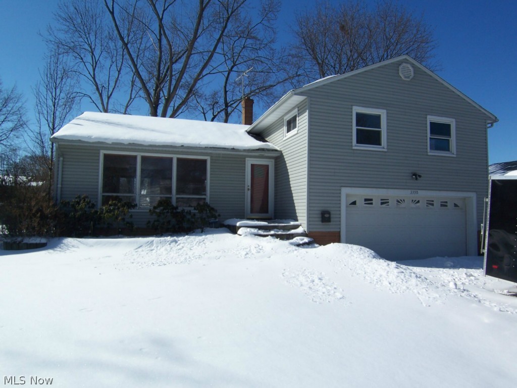 Space it the key to this 3, possible 4, bedroom and 2.5 bath 4 level split. The large living room opens to the Kitchen and Dining Area that opens to the rear deck. A fireplace highlights the family room that walks out to the back yard. A bonus/rec/4th bedroom is on the lowest level. The bathroom is updated in the master suite. Wood floors run throughout the second floor of nice sized bedrooms. The rear yard is completely fenced. This home has an attached 2 car garage, office, laundry area, and so much more. A community/private pool can be joined for a minimal cost. Ask agent for details.