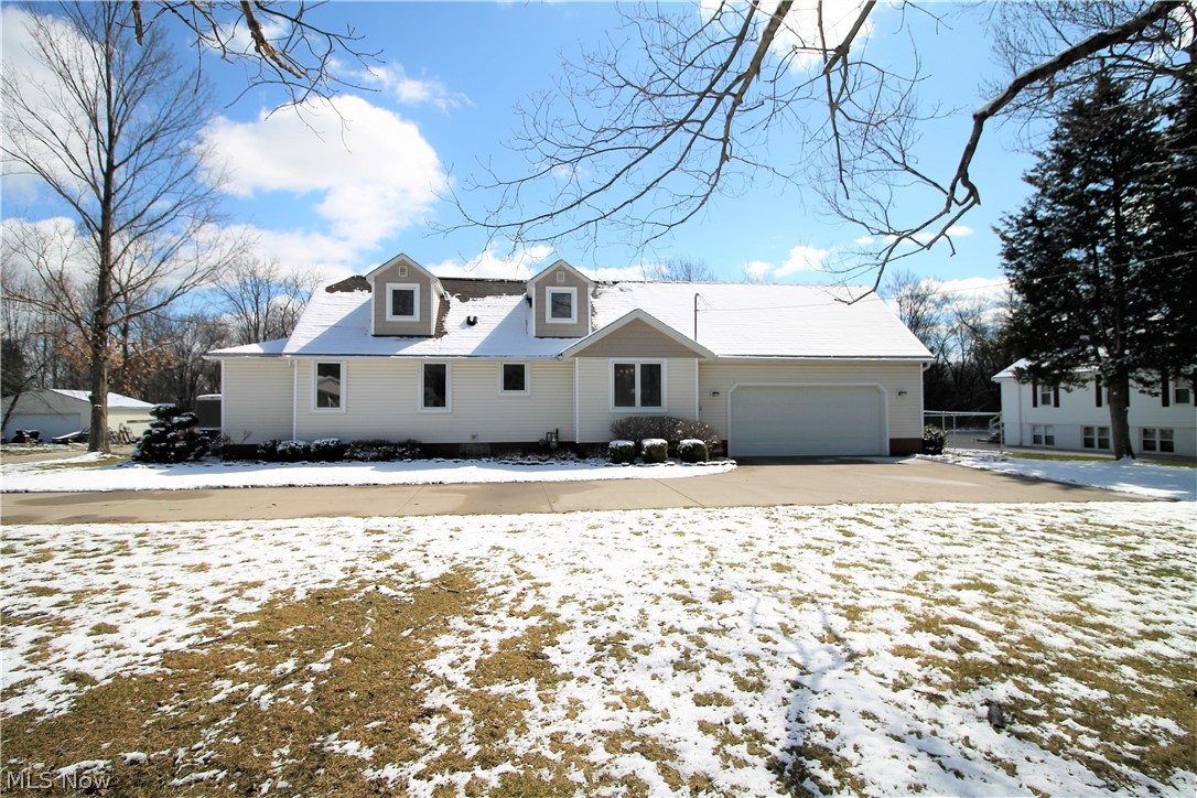 Welcome to this bright and gorgeous Cape Cod which has a first floor master suite, huge walk in closet and full bathroom. The first floor also offers a great room with spiral staircase to the upstairs, large sun room with lots of windows with built in blinds and offers so much sunshine, updated kitchen with Hickory cabinets and Corrian counters, gas range and eat in dining area. The great room and the two upstairs bedrooms are wired for speakers. To finish up the first floor there is a laundry room with cabinets and long counter and a full bathroom. The upstairs offers two bedrooms and a half bathroom, the one bedrooms has custom oak trim with built-ins. There is a huge fenced in backyard with double gate fence 2018. The two car attached garage is heated and there is a detached three plus car garage with workshop and upstairs storage. There is a large driveway and extra side pad for parking. The home offers so many updates which include modern fixtures and the home was just recently p
