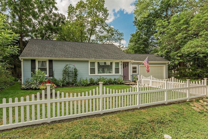 Charming Cape Cod in Chagrin Falls Village, with plenty of privacy. This lovely 3 bedroom, 1 bath home has been completely renovated. It has a charming fenced yard with lush landscaping, a very large deck in the backyard with a fire pit overlooking the creek. This home has been painted throughout inside and outside in the past 2 years. Hardwood floors in living room and bedrooms. New roof and gutters in 2019. New windows in 2017. Attached 1.5 car garage that leads to new laundry/utility room. Lifetime warrantee for Ohio State Waterproofing at a cost of $50.00 per year to new owner. Bath has been updated with new cabinetry, lighting, and tile. Kitchen has updated cabinetry and appliances along with new lighting. Kenmore washer and dryer included. Plenty of storage in the garage and second floor. Would make a wonderful home for a small family or someone wanting to downsize. Enjoy wonderful walks around the village and then come home to a relaxing back yard.