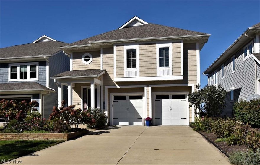 Spectacular lakefront views!! One of 9  FREE STANDING homes. Beautiful gated community. Low maintenance living!  Former model, lots of details & extras! As you enter the 2 story foyer with rich hardwood floors a you can already see magnificent views of the lake! The first floor boasts an open concept including the  living room with fireplace that flows into the dining room, all with amazing views. The high end kitchen boasts beautiful cabinetry, stainless appliances, granite, and a breakfast bar. Up the stairs or take your ELEVATOR to the 3 oversized bedrooms, all generous in size with their own bathrooms. The spacious master suite  has a large private custom  bathroom with all the bell & whistles, an enormous closet room & of course, a magical view of the outdoors & lake!. There is also a large space that could be an office. Upstairs laundry room! Inviting finished wonderful  walk out lower level with a fabulous full kitchen, guest suit and another, lovely full bathroom & walks out to