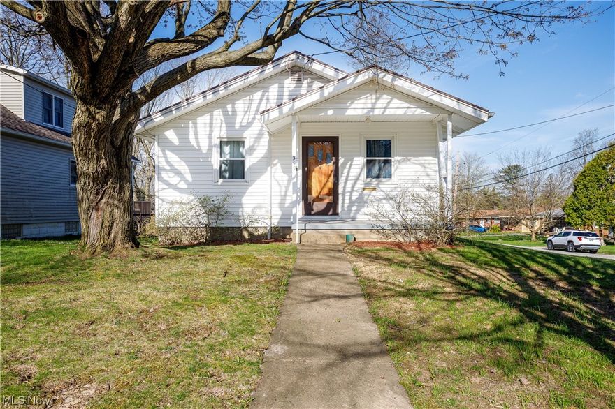 Welcome to 360 Stetler Ave, Ellet ~ 2 bedroom 2 full bath and cute as can be!  Beautiful wood floors and woodwork in living room and bedrooms. Kitchen has freshly painted solid cabinets and new counter tops, waterproof laminate flooring, faucet and lighting. First floor full bath has been updated with new flooring, medicine cabinet, faucet, toilet, lighting, sink and countertop. Several storage closets including pantry! Roof a complete tear off 5 years ago. New retaining wall on side lot. Oversized 1 car garage with carport. HWT 2011, Furnace 2005, and 100 amp electric service. Central Air.  Walk-out Basement is partially finished with a rec room and full bath.  A french drain and a backflow preventer was installed 2022 and all spouting snaked out. Covered patio and partially fenced yard. Garage added to the home in 89.  Very loved home and well maintained. A home warranty is provided by the sellers for this lovely 360 Stetler Ave, Ellet.