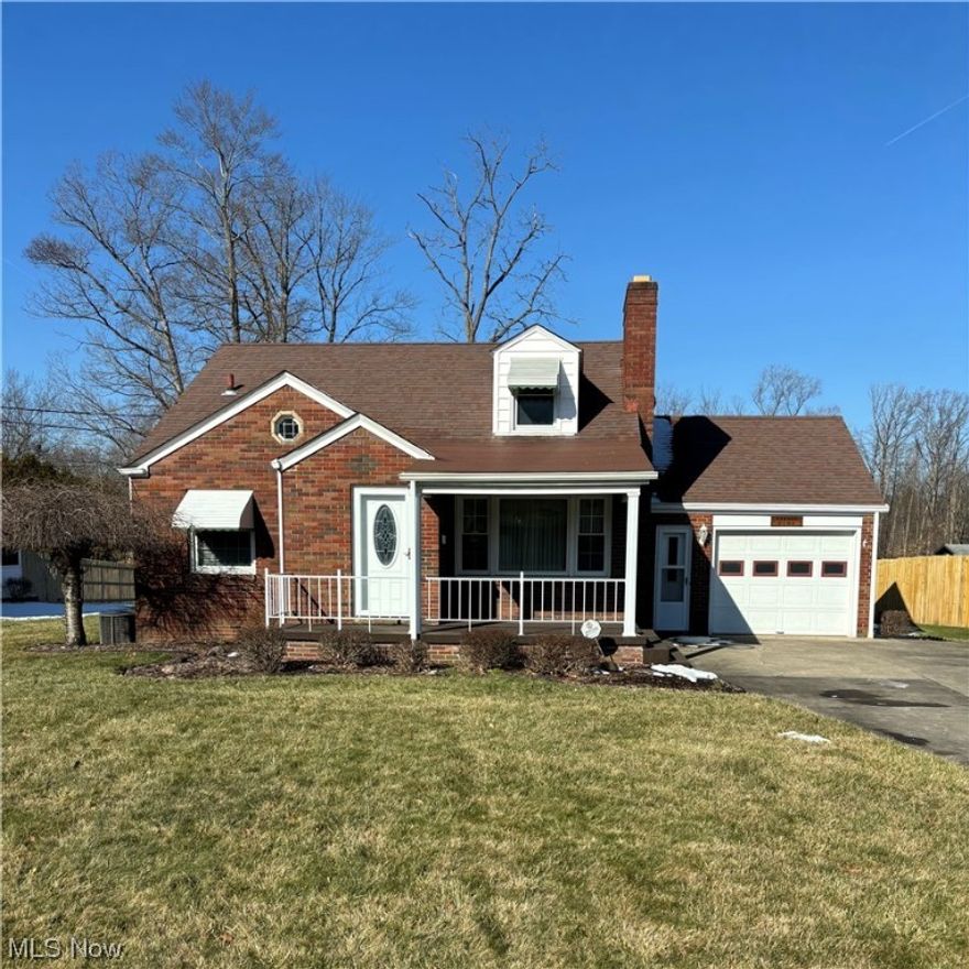 Prime West Side location!  Brick cape with cul de sac setting.  Features enclosed porch with backyard privacy, covered front porch, attached garage, living room with cut stone fireplace, 2 bedrooms with full bath on the main level with a dorm style bedroom on the second floor.  Finished rec room.  Quality brick home!