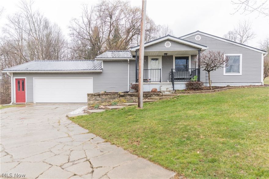 Great location with really spectacular views of the Holmes County countryside, this comfortable ranch home features extensive updates including a NEW forced air gas furnace and A/C, water heater, plumbing, and flooring. The large, eat in kitchen comes with custom, solid wood cabinets and is open to the dining area. The master bedroom includes double closets and full bath with more storage. An over-sized 2 car garage has a new garage door and opener. A large wood deck wraps around the side of the home. A small, 2 stall barn and pasture area complete this country property.