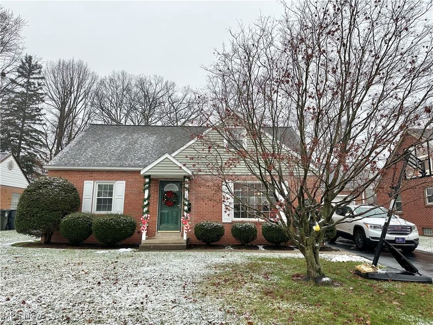 This beautifully remodeled all-brick Cape Cod-style home features a variety of modern updates. The property includes 4 spacious bedrooms and 1 full bath. The interior showcases fresh paint and refinished hardwood floors in the living room, along with updated fixtures throughout. The kitchen is designed for functionality and style, offering white cabinets, granite countertops, a stylish tile backsplash, under-cabinet lighting, a pantry, and all of the appliances. Two bedrooms on the main floor are carpeted, and the fully renovated bathroom includes a tub/shower with a tile surround. Very impressive! Upstairs, the home features two additional spacious bedrooms and convenient eave storage. The lower level has been transformed into a newly finished rec room, which can also serve as a home office. There is ample storage space in the unfinished section, which also contains the laundry area equipped with a washer and dryer. Exterior highlights include an easy-to-maintain yard, a concrete patio, a detached garage, and a storage shed. Recent updates to the home encompass central air conditioning (installed in 2021), vinyl double-hung windows, a new microwave, and a newer oven. This property is a real gem!