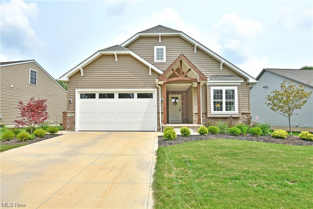 Stunning from every angle and filled with over $100k in stylish, modern upgrades, this engaging Amish-built Middlefield home is one you
won’t want to miss! Expert landscaping lines the mulch beds as the rustic woodwork trims the covered
entryway, pairing with a partial stone façade for captivating curb appeal. Around the back, the relaxing
raised deck transitions into a laid stone patio as trees line the perimeter for added privacy. The grand
foyer welcomes you inside with its sculpted ceiling and backlit crowns. With 3 different sliding barn doors, one that hides first
floor laundry as a pair of inviting guest bedrooms branch away nearby as the short hall is completed by a
ravishing full bath with its elegant vanity. The great room easily excites with its prominent open layout
and window lined far wall that bathes the surroundings in natural light. Hardwood styled flooring
sweeps through the thoughtful kitchen complete with corner pantry and striking slate colorways. B
