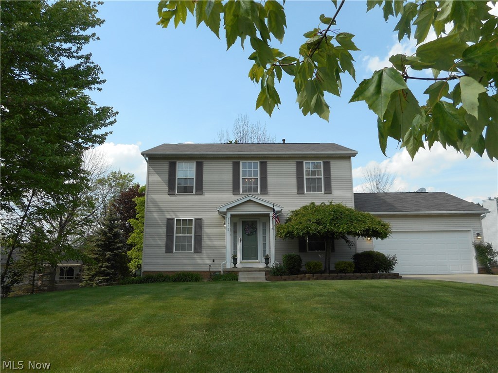 Fantastic find! Meticulously maintained and neutral 3 bedroom, 2 1/2 bath colonial! Open and spacious floor plan! Living room is open to the dining area with sliders to the nice deck overlooking private back and side yard. Awesome kitchen featuring new subway tile and vinyl flooring (2016) offers plenty of cabinet and counter space & stainless steel appliances. Family room with hardwood flooring, half bath and laundry room complete the first floor. Master suite with 7 x 10 walk in closet and full bath, Two additional bedrooms with nice closet space. New roof (tear off) in 2016, freshly painted, new carpet & new flooring in kitchen & laundry room in 2016. Within minutes of Aurora Farms, highway access, shopping and restaurants.