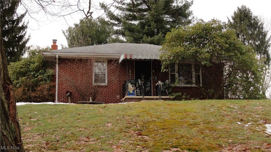 Quaint brick bungalow on 1/2 an acre.  Mature trees, 2 car garage, parking area.  2 bedrooms on main floor, nice size living room.  Open kitchen and dining area.  Full basement with full bath and Ben Franklin fireplace.  Newer roof on house.  Enjoy wooded country setting on an easy​​‌​​​​‌​‌​​​‌‌​​​‌‌‌​​‌​​‌‌​​​​ budget.