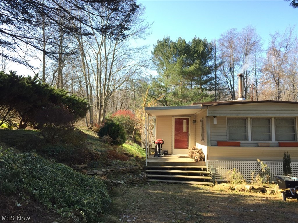 Beautiful wooded almost 5 acres in River View School District. Older, but very well maintained single wide. Offers 4 bedrooms. Owner has added 2 bedrooms and nice dining area off the kitchen. Some newer windows throughout. Picturesque views from everywhere. New well approximately 10 years old. Dual septic tanks installed approximately 1984-1985. Nice size master bedroom with a deck, to enjoy morning coffee, over looking the woods. Ramp off back deck as well. Owners added 2 bedrooms. Each being 12x12. Also, 24x8 added for dining area. Giving approximately 1200 square feet living area.
If Privacy is what you desire, you may want to do a walk through soon.... Picturesque setting